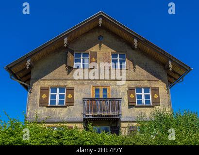 Vecchia casa con facciata in ghiaia, Allgäu, Baviera, Germania Foto Stock