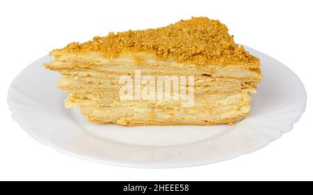 Una fetta di torta su un piatto. Isolare su sfondo bianco. Strati la torta. Foto Stock