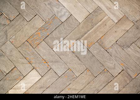 Vecchio parquet usato fatto di tavole rettangolari di legno, vista dall'alto. Trama della foto di sfondo Foto Stock