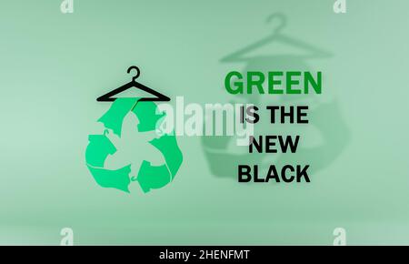 Il verde è il simbolo dei nuovi abiti neri da riciclato sull'appendiabiti, illustrazione 3D Foto Stock