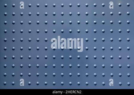 sfondo armonico metallico grigio con macchie in pattern regolare Foto Stock