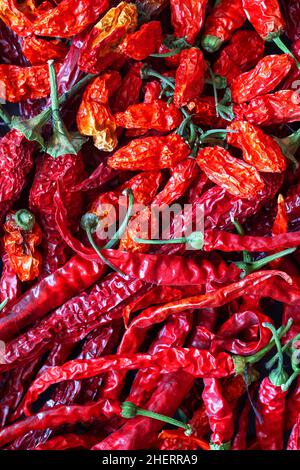Rosso piccante piccante peperoni fondo cibo. Peperoncini Foto Stock