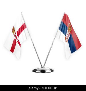 Due bandiere di tabella isolate su sfondo bianco 3D illustrazione, irlanda del Nord e serbia Foto Stock