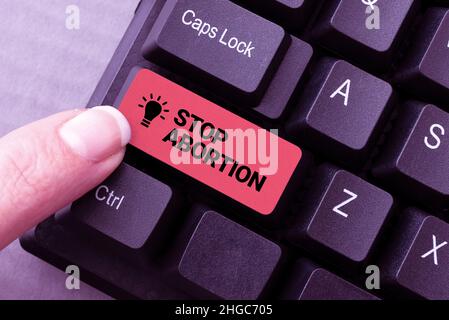 Scrittura visualizzazione testo Interrompi aborto. Approccio aziendale che sostiene contro la pratica di aborto ProLife movimento scaricare file online e. Foto Stock