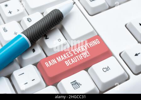 Il segno di scrittura della mano Rain rende tutto bello. Business approccio raining crea terra un luogo meraviglioso digitando programma descrizioni funzionali Foto Stock