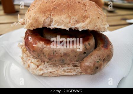 ring cumberland bap in una colazione marrone bap mattina tradizionale salsiccia lago distretto, cumbria, inghilterra, regno unito Foto Stock
