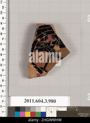 Terracotta fragment of a lekanis lid (covered dish) second quarter of the 6th century B.C. Greek, Attic Part of the car and wheel of a chariot to right. Terracotta fragment of a lekanis lid (covered dish). Greek, Attic. second quarter of the 6th century B.C.. Terracotta; black-figure. Archaic. Vases Stock Photo