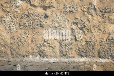 Muro in pietra come sfondo architettonico. Foto Stock