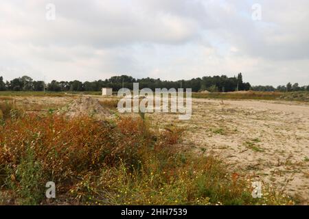 Sabbia e sabbia viva nei campi dove sorgerà un nuovo quartiere residenziale. Foto Stock