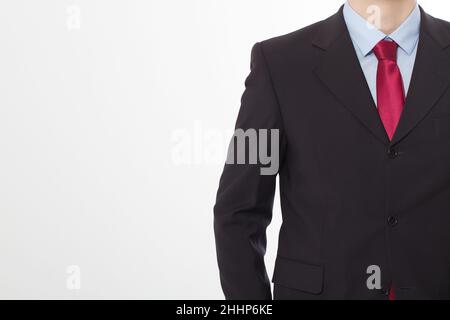 Primo piano bell'uomo in abito elegante isolato su sfondo bianco. Concetto di business e business. Copia lo spazio e riponi. Immagine ritagliata Foto Stock