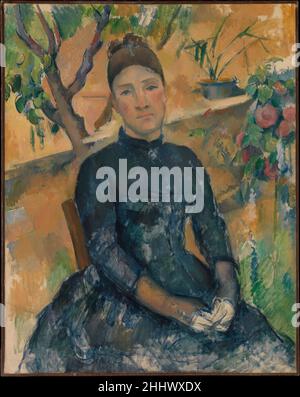 Madame Cézanne (Hortense Fiquet, 1850–1922) nel Conservatorio 1891 Paul Cézanne il francese Hortense Fiquet, modello di un ex artista, incontrò Cézanne circa 1869; ebbero un figlio nel 1872, quattordici anni prima di sposarsi. Questo dipinto, una delle più di due dozzine per le quali Hortense posò, è situato nel conservatorio di Jas de Bouffan, la proprietà della famiglia Cézanne vicino Aix. La tela incompiuta offre un’idea eloquente del metodo di lavoro di Cézanne. Ha posto la testa accuratamente modellata di Madame Cézanne leggermente decentrata, cullato tra un albero rigoglioso e una pianta spindly, e poi ha continuato a costruire il Foto Stock