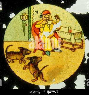 Storia di un uomo e due cani che prendono le sue scarpe, foto 2. Foto Stock