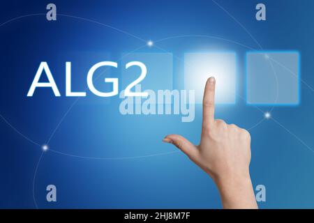 alg2 - Arbeitslosengeld 2 - parola tedesca per indennità di disoccupazione o dole money - pulsante mano su interfaccia con sfondo blu. Foto Stock