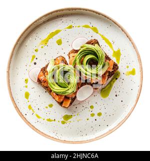 Piatto isolato di avocado toast con salmone Foto Stock