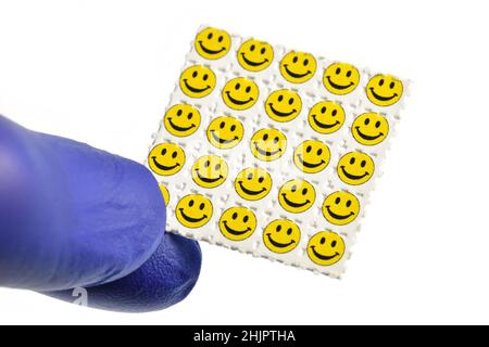 Smiley viso acido viaggi, carta blotting impregnato con il farmaco L.S.D.- acido lisergico dietilammide. Foto Stock