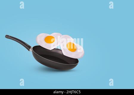 Idea creativa con una padella e due uova fritte a forma di cuore su sfondo blu brillante. Cibo minimo e concetto di amore. Idea colazione per Val Foto Stock