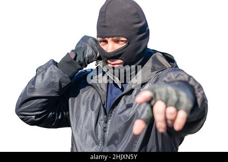 il volto malvagio di un bandito mascherato su sfondo bianco Foto Stock