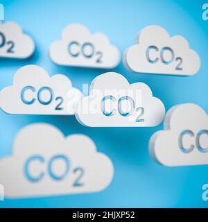 CO2 concetto. Diversi oggetti a forma di nuvola con la parola CO2 punzonata davanti a uno sfondo blu. Foto Stock