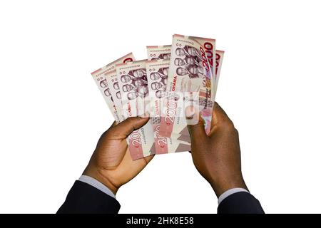 Mani nere in tuta con 3D note di cedi Ghanaian rese Foto Stock