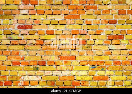 Vibrante parete mattone texture modello pietra muratura sfondo. Vecchia texture in mattoni. Sfondo texture muratura muro mattoni sfondo. Vecchio mattone giallo Foto Stock