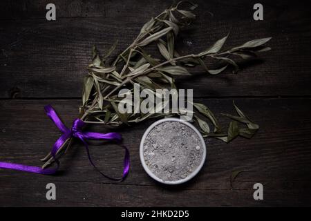 bowl with ashes and olive branch. ash wednesday concept Stock Photo