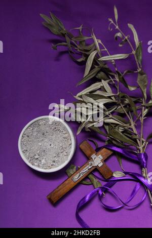 bowl with ashes and olive branch. ash wednesday concept Stock Photo