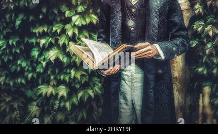 Alchemist in un bel vestito ornamentale in natura. Foto Stock