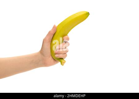 Un mazzo di banane in mano donna isolato su sfondo bianco. Foto Stock