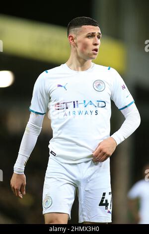 Norwich, Regno Unito. 12th Feb 2022. Phil Foden di Manchester City guarda avanti. Premier League Match, Norwich City contro Manchester City a Carrow Road a Norwich sabato 12th febbraio 2022. Questa immagine può essere utilizzata solo a scopo editoriale. Solo per uso editoriale, licenza richiesta per uso commerciale. Nessun uso in scommesse, giochi o un singolo club/campionato/player pubblicazioni. pic di Steffan Bowen/Andrew Orchard sport fotografia/Alamy Live news credito: Andrew Orchard sport fotografia/Alamy Live News Foto Stock