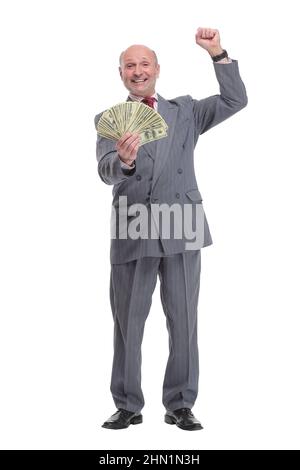 Signore anziano eccitato che tiene una pila di soldi Foto Stock