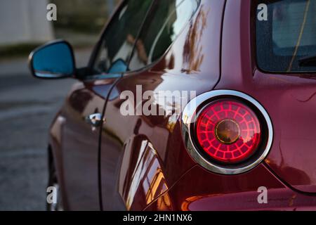 Close up of the rear view of small car at the dusk Foto Stock