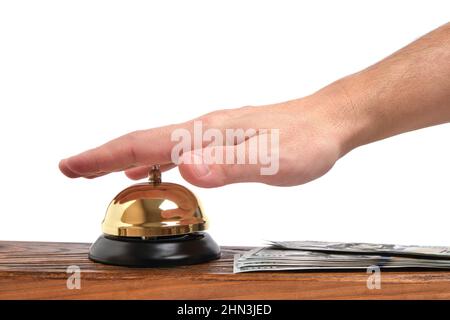 Premendo la vostra mano Bell servizio hotel e dollari Table.Concept hotel, viaggi e vacanze pagate Foto Stock