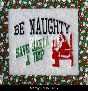 Decorazione di Natale, testo, parole, essere cattivi: Salvare Babbo Natale un viaggio, umoristico, tessuto, ricamo a macchina, vacanza, Artigianato, tessitura, PR Foto Stock