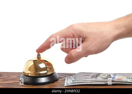 Premendo la vostra mano Bell servizio hotel e dollari Table.Concept hotel, viaggi e vacanze pagate Foto Stock