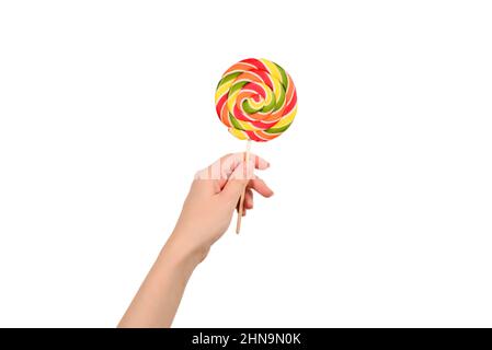 Lollipop in mano femmina isolato su sfondo bianco. Spazio per testo o disegno. Foto Stock