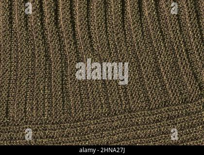 Texture maglione di lana color caffè. Tessuto sciarpa di lana lavorato a mano in vermillion marrone Foto Stock