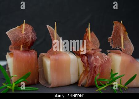 cibo di sottofondo con melone e prosciutto di parma Foto Stock