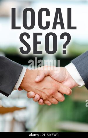 Segno di testo che mostra Seoquestion locale, foto concettuale modo incredibilmente efficace per commercializzare il vostro business locale online due professionale ben vestito Corp Foto Stock