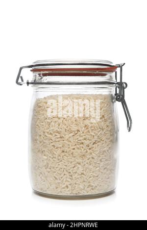 Un barattolo riempito di riso bianco. Foto Stock
