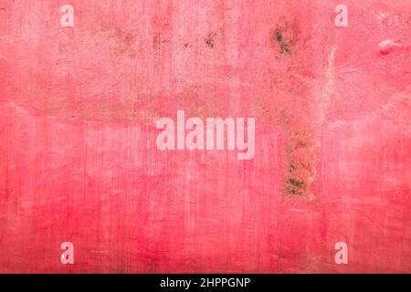 Grunge colore rosa cemento parete fondo struttura. Foto Stock