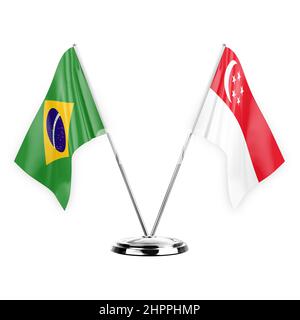 Due bandiere di tabella isolate su sfondo bianco 3D illustrazione, brasile e singapore Foto Stock