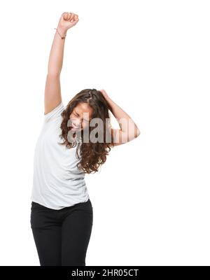 Shes positivamente casual. Studio girato di una donna completamente naturale isolato su bianco. Foto Stock