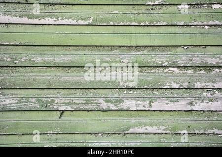 Sfondo da vecchie tavole di legno (travi di legno). Texture vintage, sfondo. Colore verde sbiadito Foto Stock