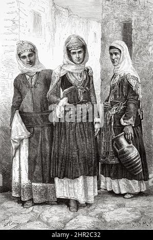 Donne vestite in tradizionale abito greco dalla città di Megare, Grecia. Viaggio in Grecia di Henri Belle Foto Stock