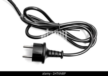 Spina elettrica e filo nero su sfondo bianco. Foto Stock