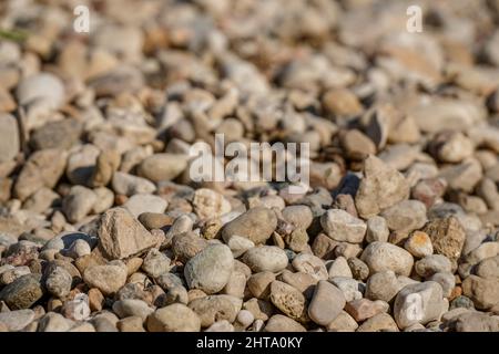 Sfondo di ciottoli rotondi e lisci, primo piano di texture naturale Foto Stock