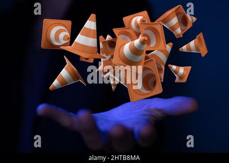 3D rendering di vivaci coni di traffico arancioni galleggianti nell'aria con una mano sotto di loro Foto Stock