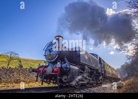 GWR 1500 classe 0-6-0PT shunting motore numero 1501 dalla Severn Valley Railway trasporta un treno per Irwell vale Halt sulla East Lancashire Railway d Foto Stock