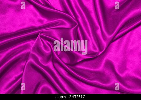 Trama in raso rosa stropicciato, motivo bellissimo, vista dall'alto. Foto Stock