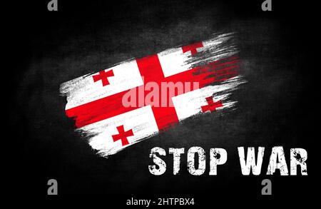 Un colpo di vernice con la bandiera della Georgia con la didascalia STOP guerra, il concetto di fermare le ostilità sul territorio dell'Ucraina Foto Stock